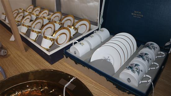 Two matching Royal Worcester gilt-bordered coffee sets and another Royal Worcester coffee set (3, boxed)